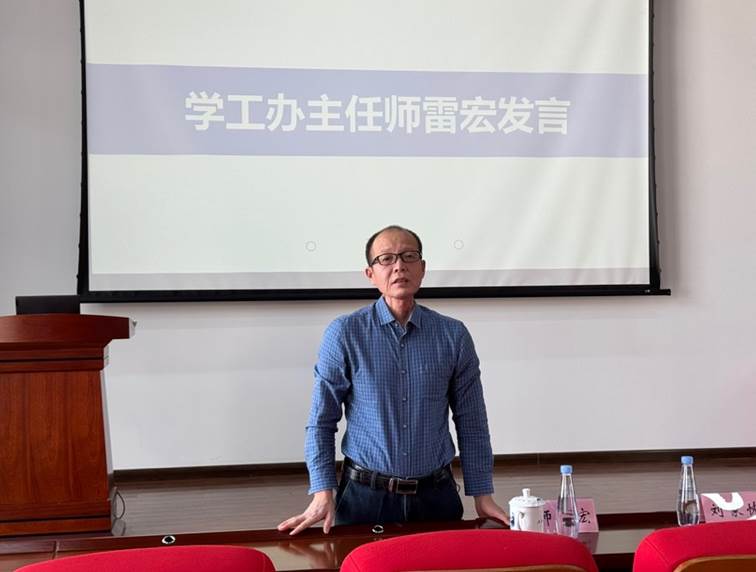A person standing in front of a screen AI-generated content may be incorrect. A person standing in front of a screen AI-generated content may be incorrect.